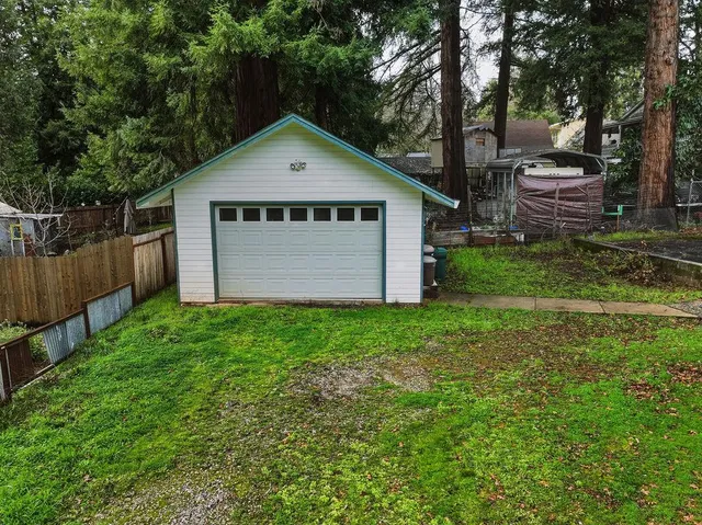 a house with green field in front of it