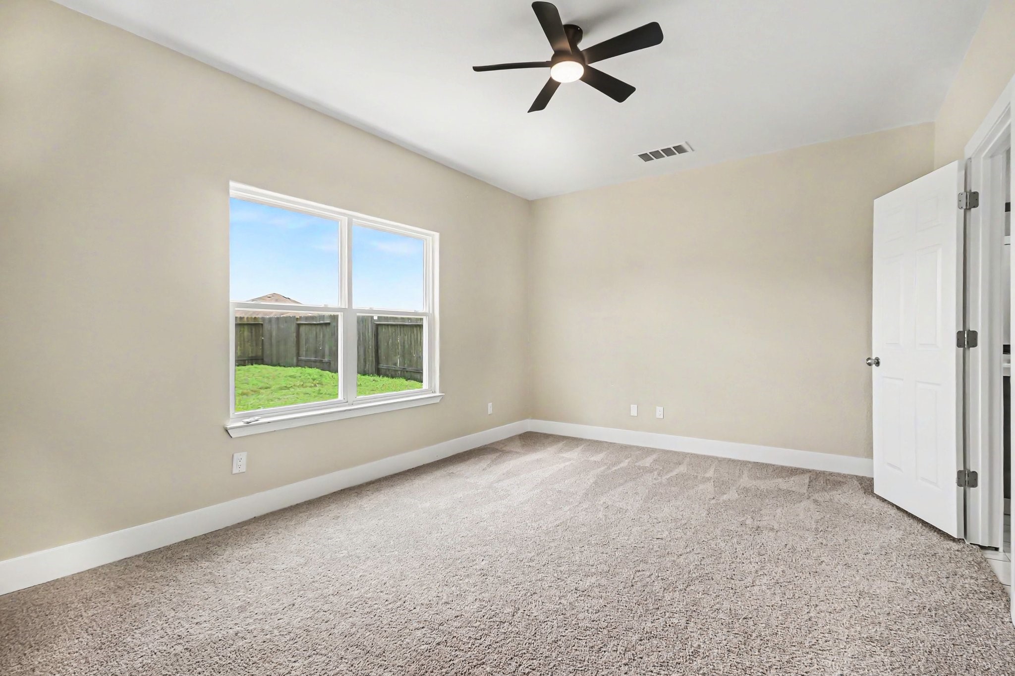 1322 Diamond Drape Drive Rosharon, TX 77583 - Photo 18 of 45 a view of an empty room with a window