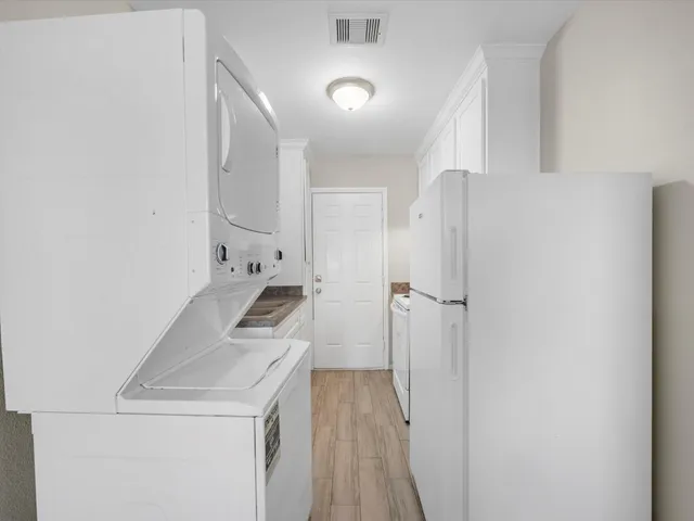 a kitchen with a sink and refrigerator