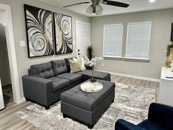 a living room with furniture and a window