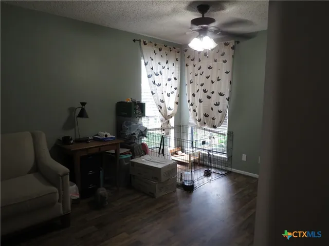 a view of an entryway with wooden floor