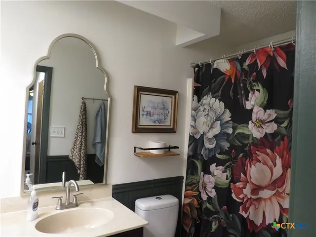 a room with a sink and a mirror