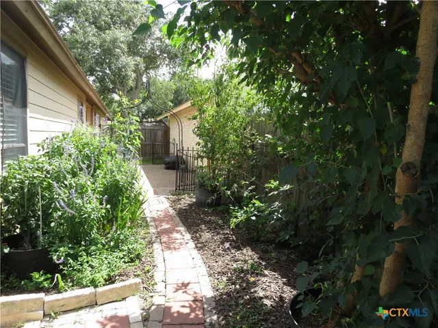 a backyard of a house with lots of green space