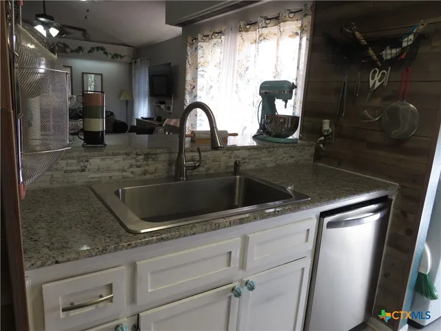 a kitchen with a stove and a microwave