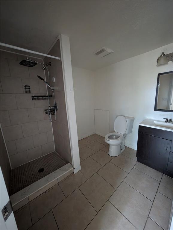 3227 Darlington Road Holiday, FL 34691 - Photo 12 of 15 a bathroom with a toilet and a shower