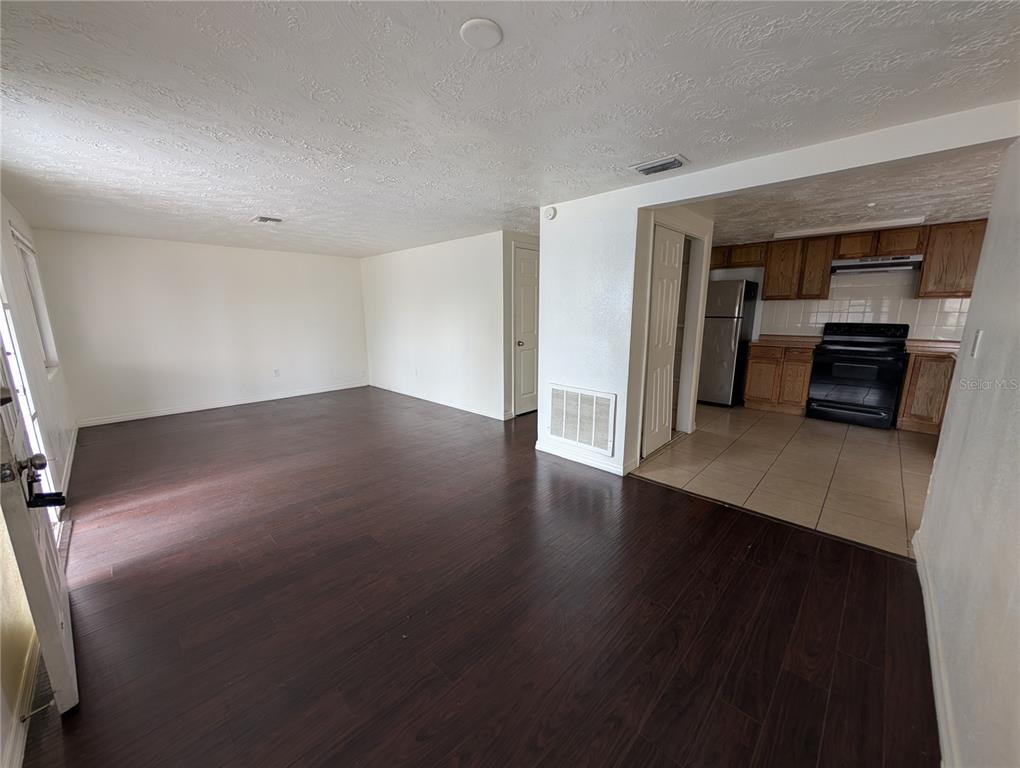 3227 Darlington Road Holiday, FL 34691 - Photo 2 of 15 a view of a livingroom with wooden floor