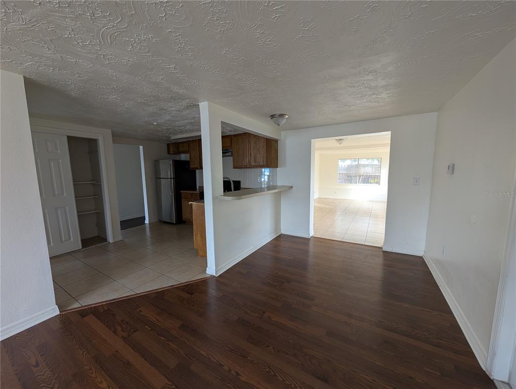 3227 Darlington Road Holiday, FL 34691 - Photo 6 of 15 a view of a kitchen from a hallway