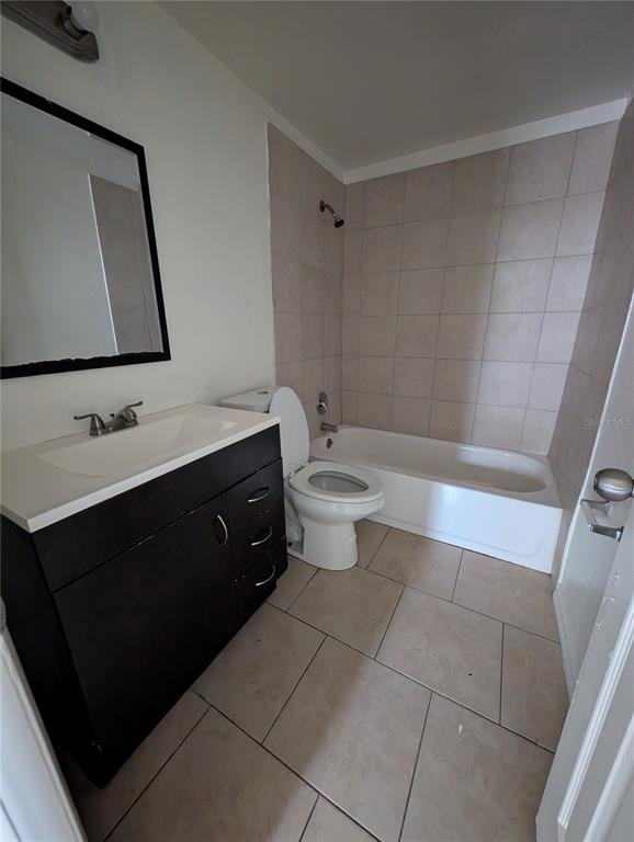3227 Darlington Road Holiday, FL 34691 - Photo 7 of 15 a bathroom with a double vanity sink toilet and mirror