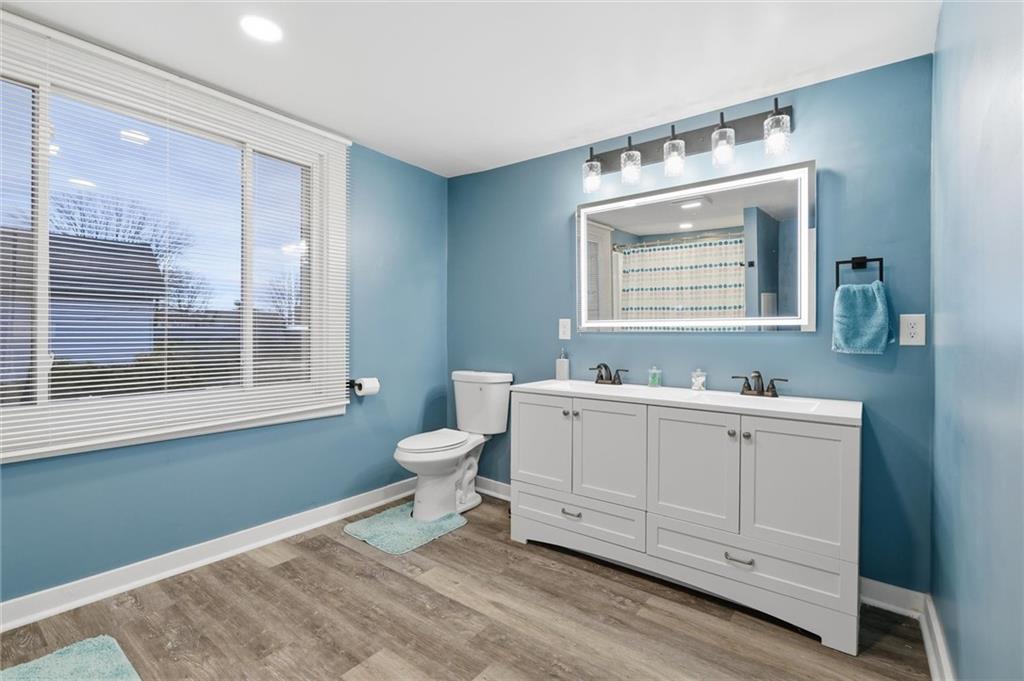 244 Tyler Avenue Washington, PA 15301 - Photo 19 of 27 a bathroom with a toilet sink and mirror