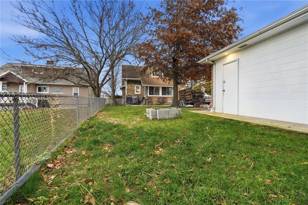 244 Tyler Avenue Washington, PA 15301 - Photo 24 of 27 a front view of a house with a yard