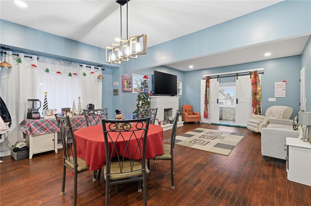 244 Tyler Avenue Washington, PA 15301 - Photo 6 of 27 a view of a dining room with furniture a chandelier and wooden floor