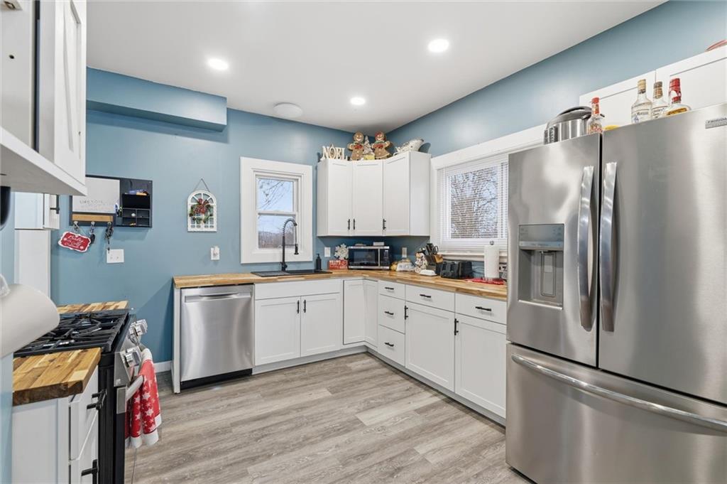244 Tyler Avenue Washington, PA 15301 - Photo 7 of 27 a kitchen with granite countertop a refrigerator stove and sink