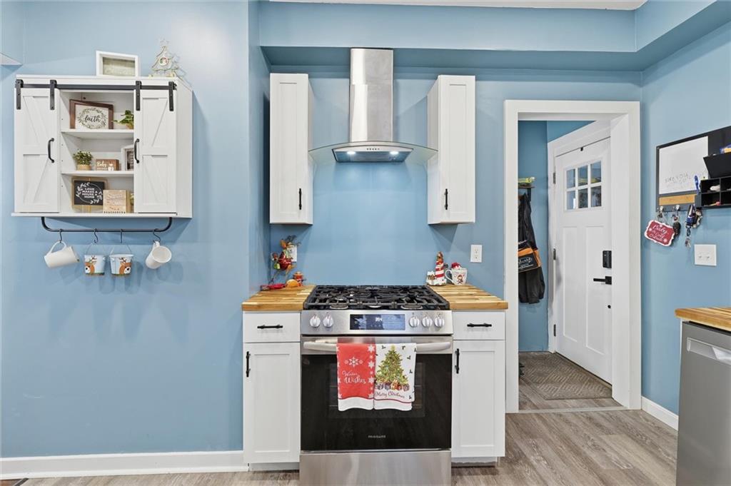 244 Tyler Avenue Washington, PA 15301 - Photo 8 of 27 a kitchen with stainless steel appliances granite countertop a stove and a microwave