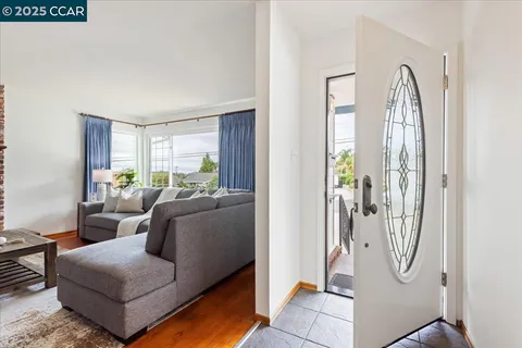 a living room with furniture and a gate