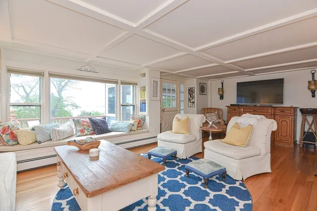 a living room with furniture and a rug