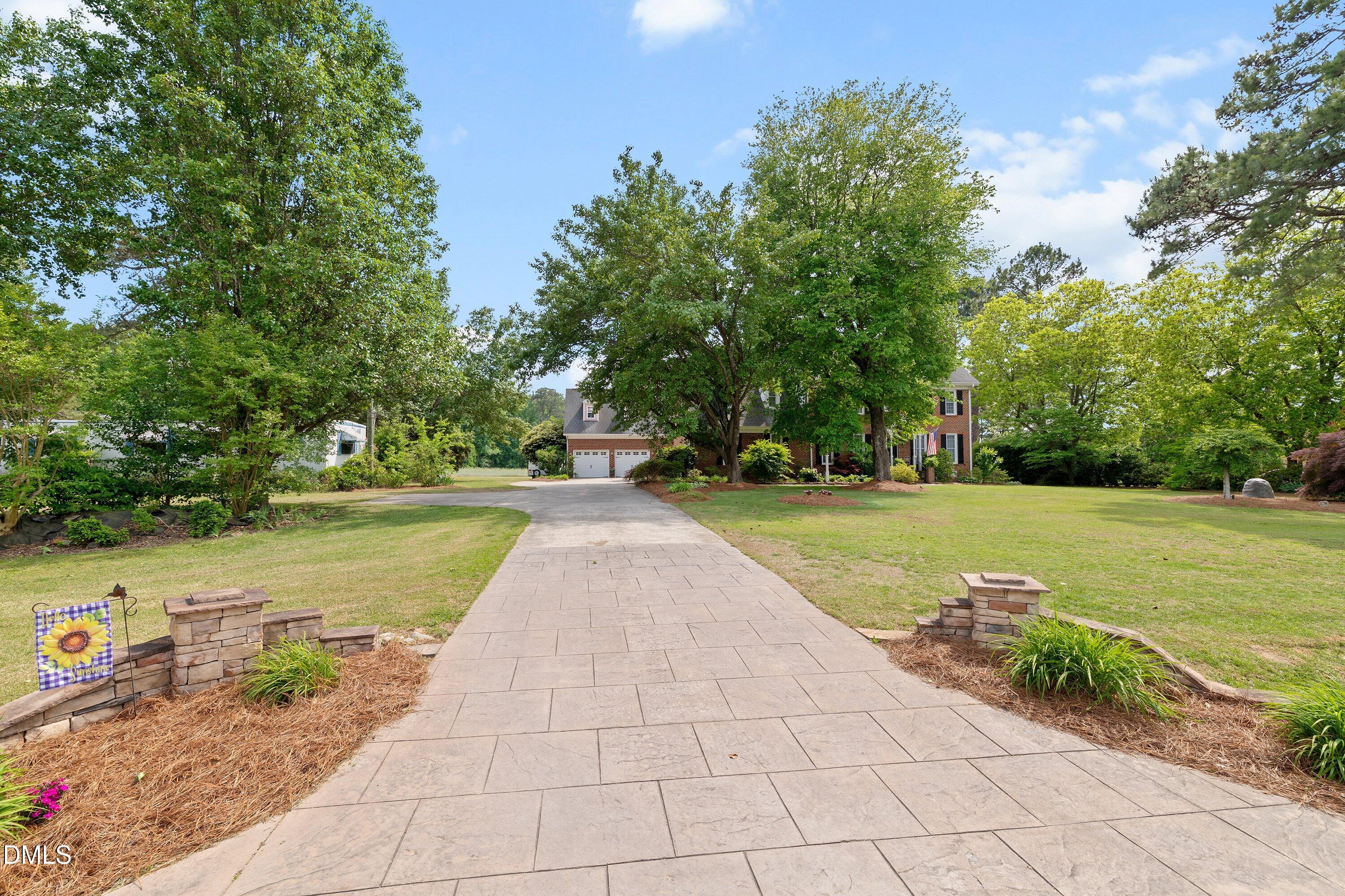 6612 Fowler Road Zebulon, NC 27597 - Photo 2 of 42 a view of a garden with an outdoor space