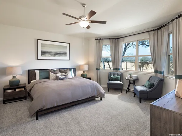 a bedroom with a bed and a couch