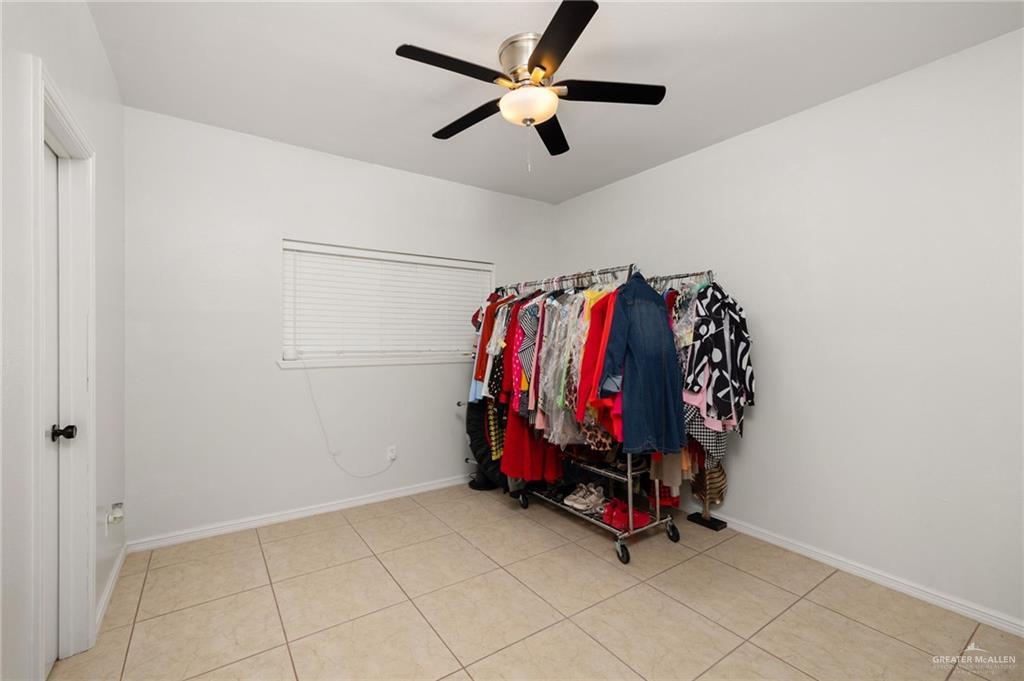 3309 South McColl Road Edinburg, TX 78539 - Photo 14 of 27 Spacious closet featuring light tile patterned floors and ceiling fan