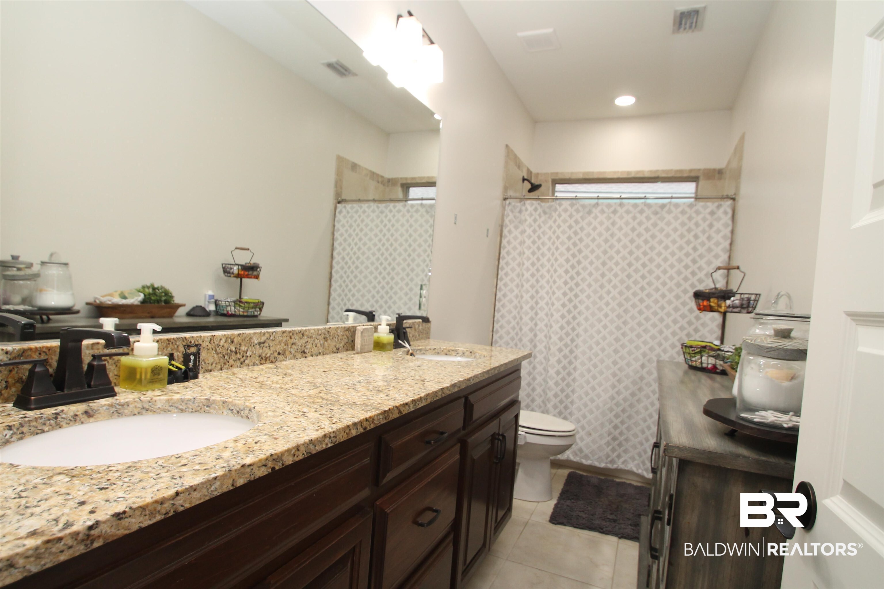 30232 Persimmon Drive Daphne, AL 36527 - Photo 17 of 27 Full bath featuring toilet, visible vents, and a sink