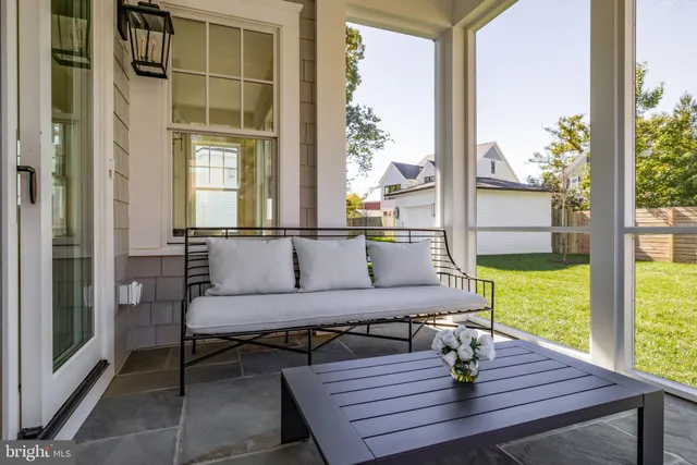 a living room with a table and chairs