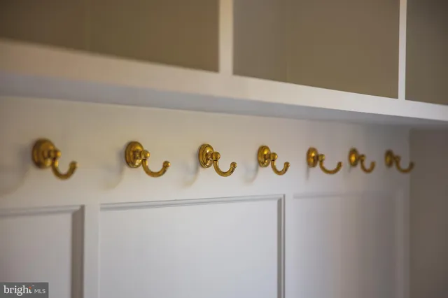 a white refrigerator with white cabinets