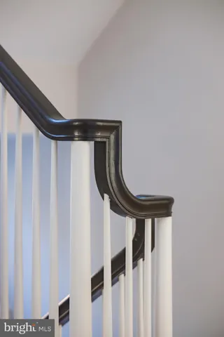 a living room with furniture and wall painting