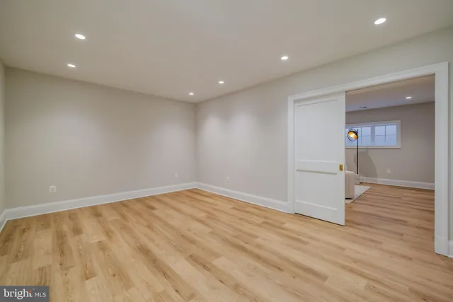 a view of a room with wooden floor and natural light