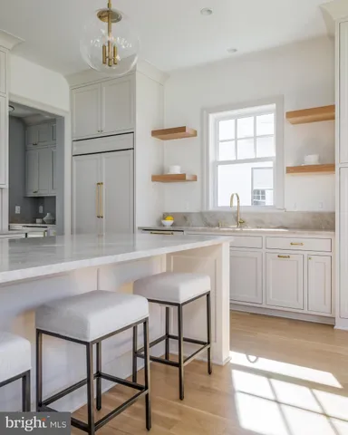 a kitchen with a sink cabinets and window