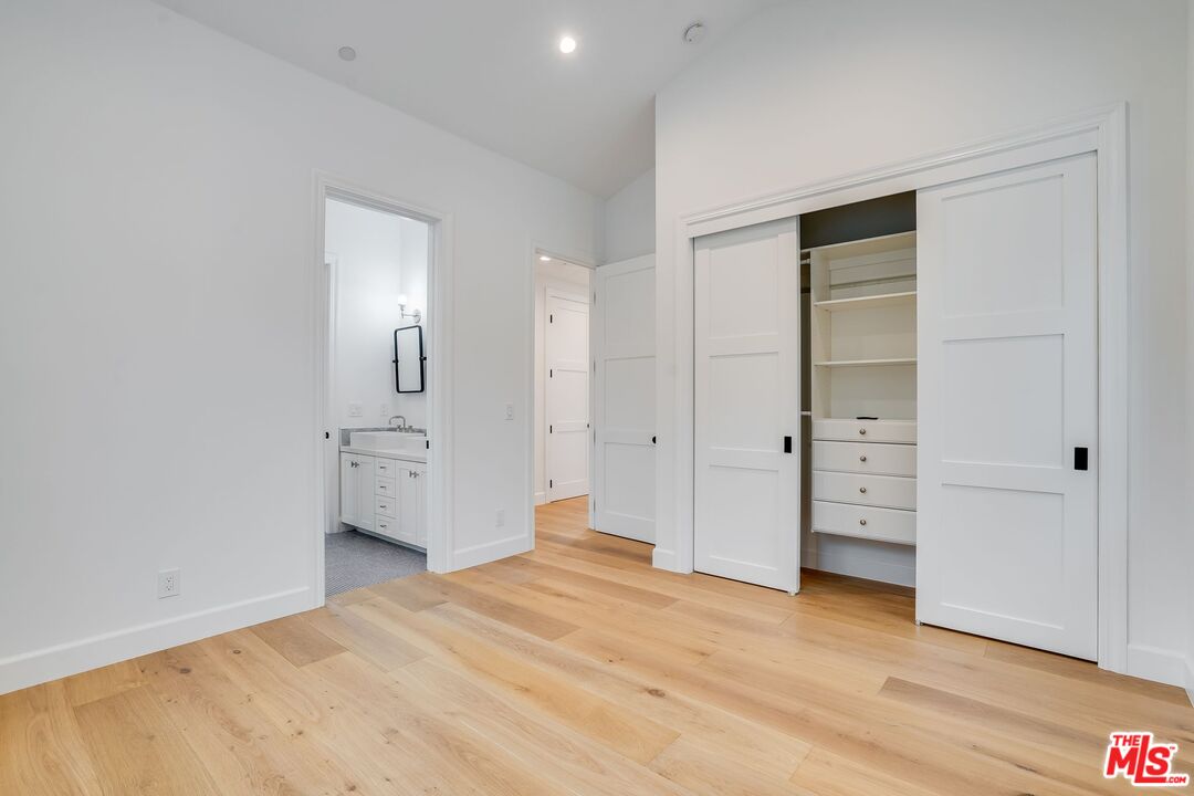 26575 Ocean View Drive Malibu, CA 90265 - Photo 12 of 39 a view of empty room with wooden floor and cabinet