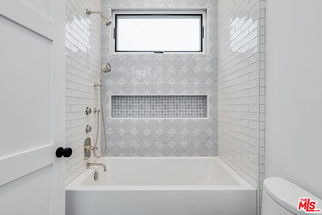 26575 Ocean View Drive Malibu, CA 90265 - Photo 16 of 39 a bathroom with a bathtub