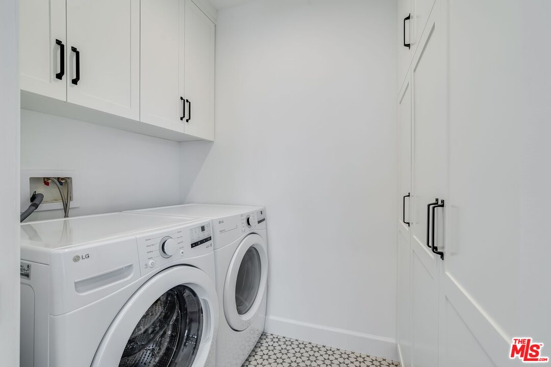 26575 Ocean View Drive Malibu, CA 90265 - Photo 19 of 39 a utility room with dryer and washer