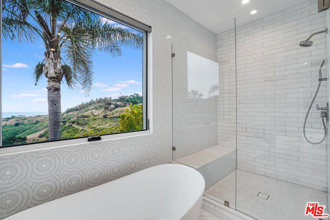 26575 Ocean View Drive Malibu, CA 90265 - Photo 26 of 39 a bathroom with a bathtub and a shower