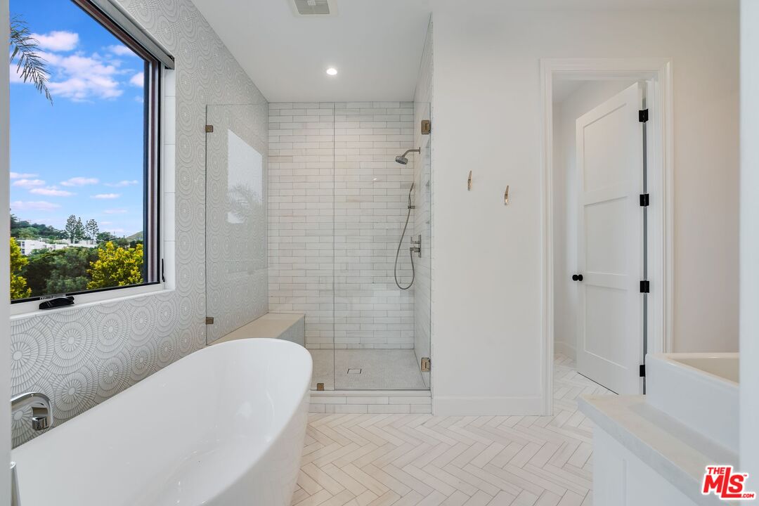 26575 Ocean View Drive Malibu, CA 90265 - Photo 27 of 39 a bathroom with a bathtub and a shower