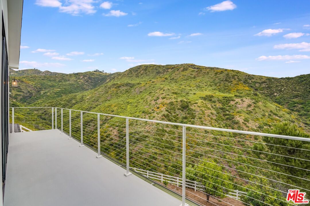26575 Ocean View Drive Malibu, CA 90265 - Photo 30 of 39 a view of a balcony with a yard