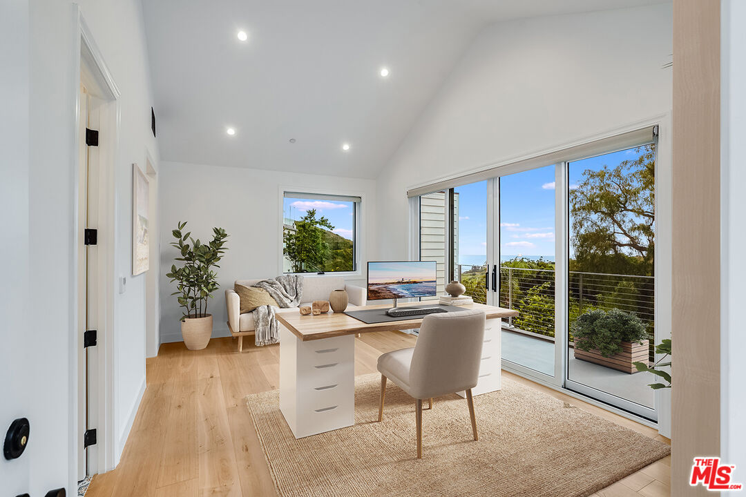 26575 Ocean View Drive Malibu, CA 90265 - Photo 31 of 39 a view of a dining room with furniture window and wooden floor
