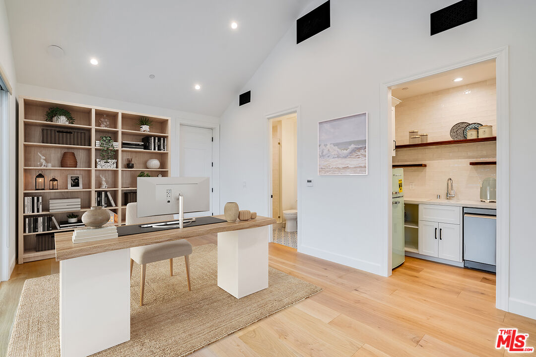 26575 Ocean View Drive Malibu, CA 90265 - Photo 32 of 39 a kitchen with a sink cabinets and wooden floor