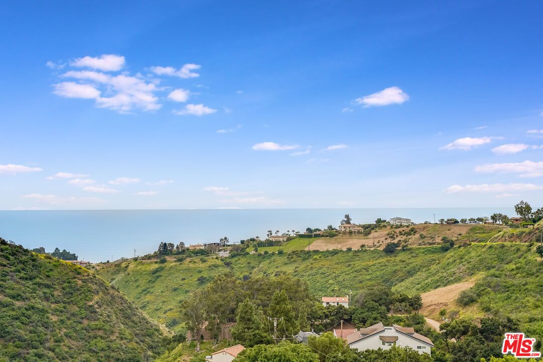 26575 Ocean View Drive Malibu, CA 90265 - Photo 38 of 39 a view of a houses with a yard and mountain view