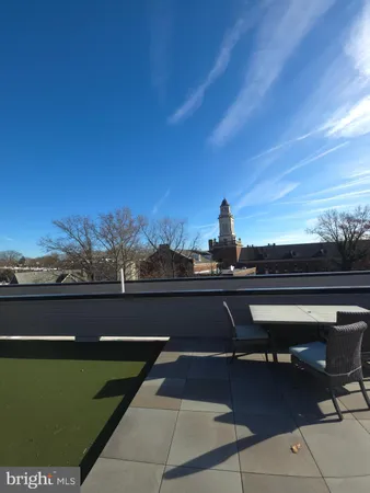 a view of a terrace with a garden