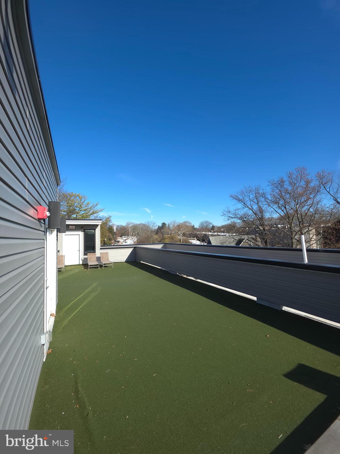 3503 Midvale Avenue, Unit 404 Philadelphia, PA 19129 - Photo 22 of 37 a view of a terrace with a garden