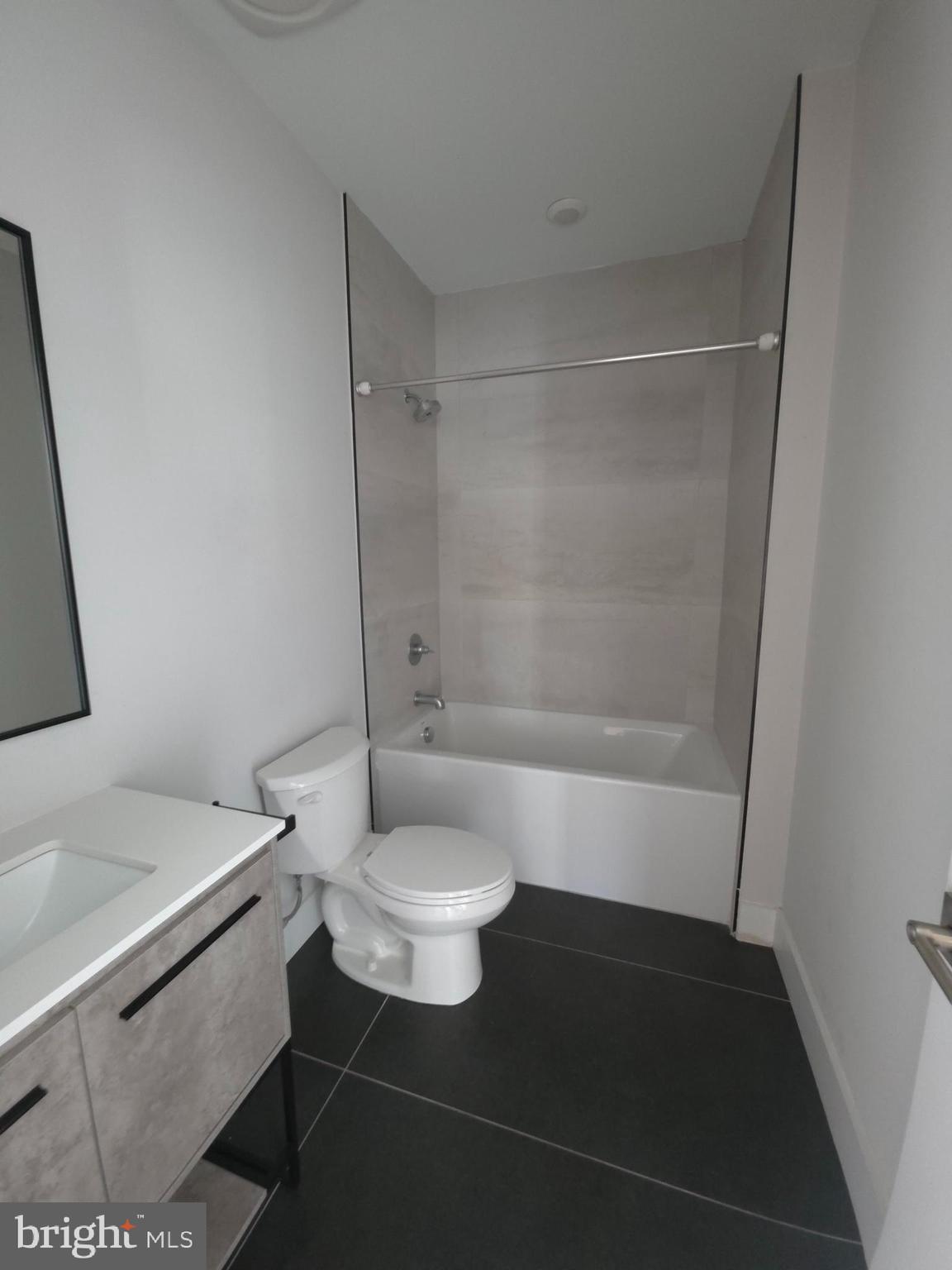 3503 Midvale Avenue, Unit 404 Philadelphia, PA 19129 - Photo 28 of 37 a bathroom with a sink a toilet and shower