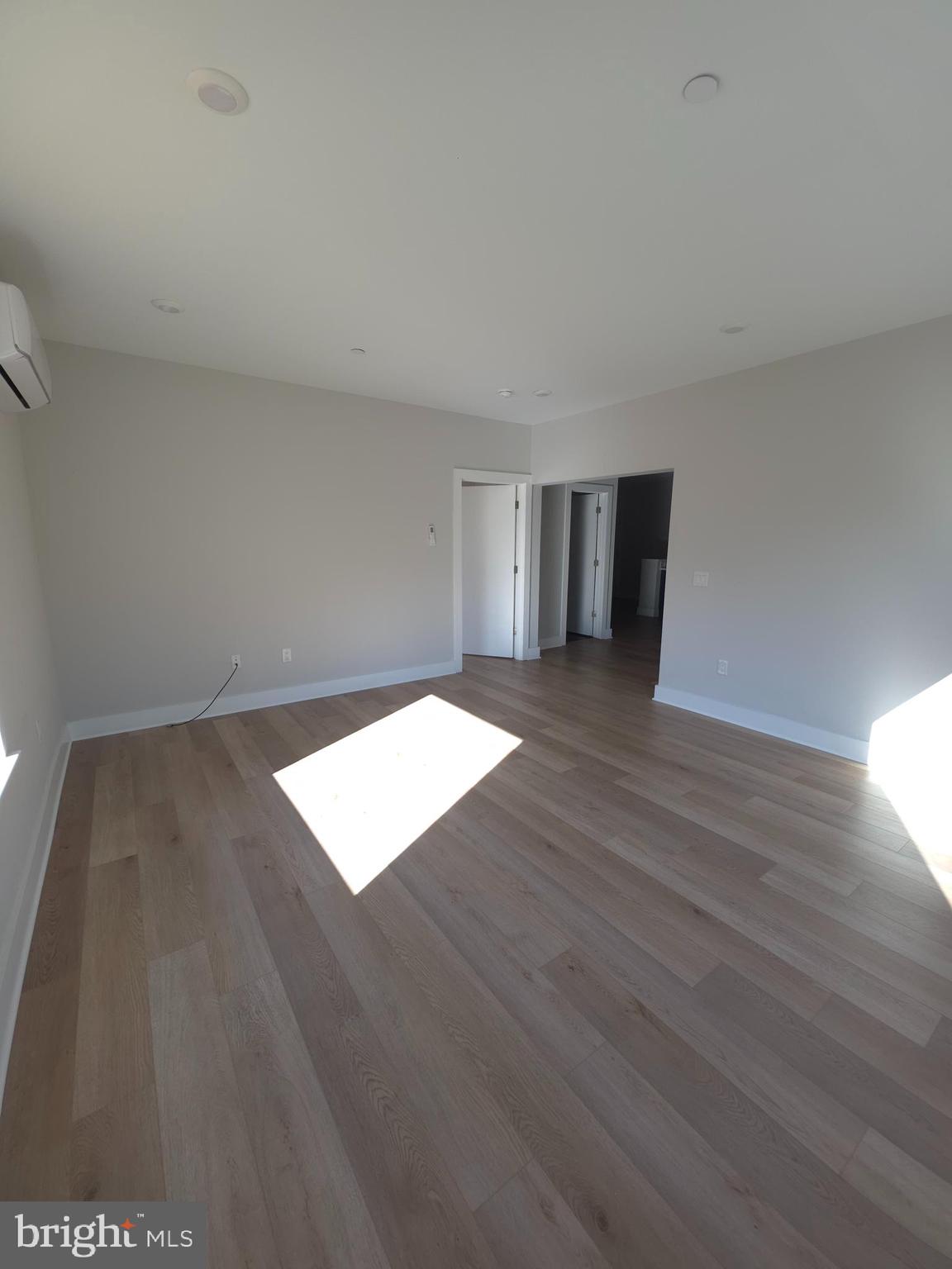 3503 Midvale Avenue, Unit 404 Philadelphia, PA 19129 - Photo 29 of 37 a view of an empty room with wooden floor