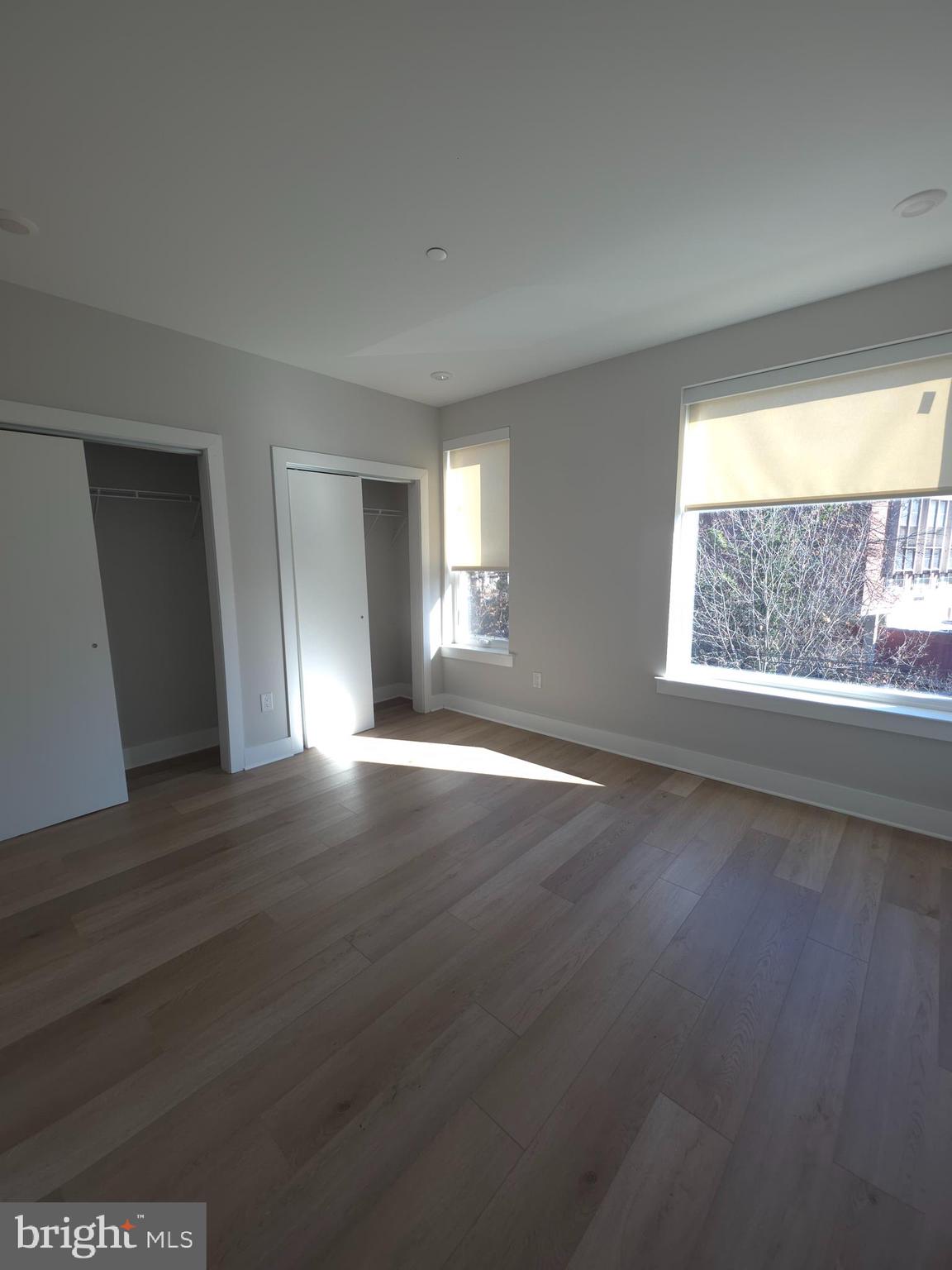 3503 Midvale Avenue, Unit 404 Philadelphia, PA 19129 - Photo 33 of 37 a view of an empty room with wooden floor and a window