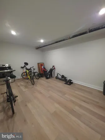 a room with gym equipment and a large window