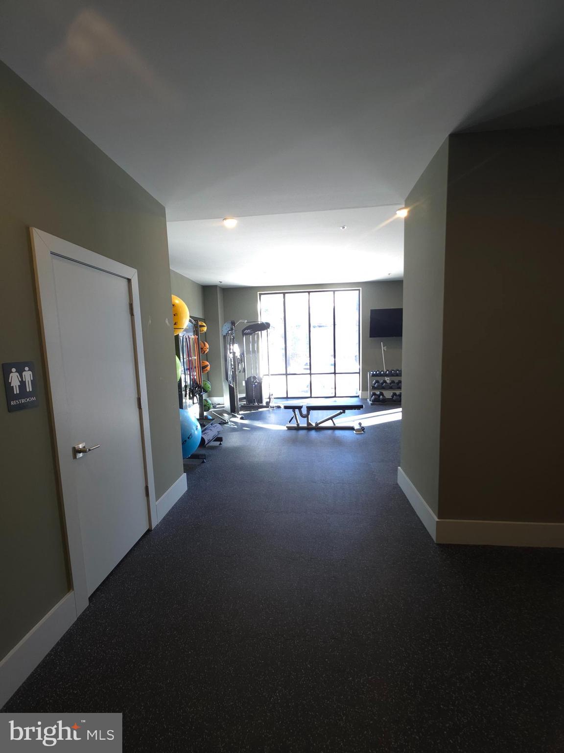 3503 Midvale Avenue, Unit 404 Philadelphia, PA 19129 - Photo 9 of 37 a view of hallway with livingroom and furniture