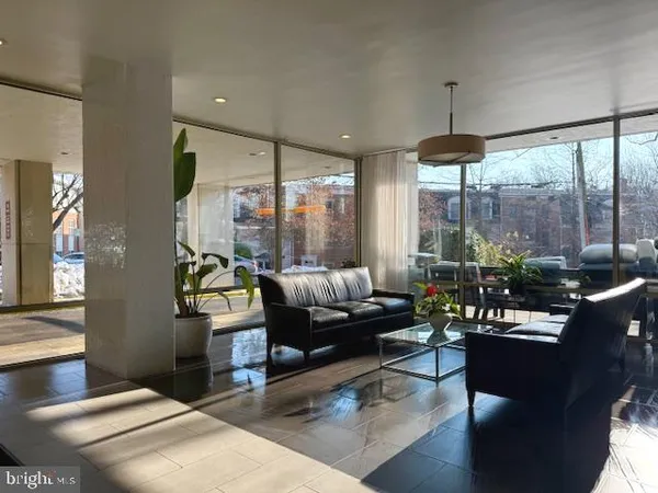 a living room with furniture and a large window