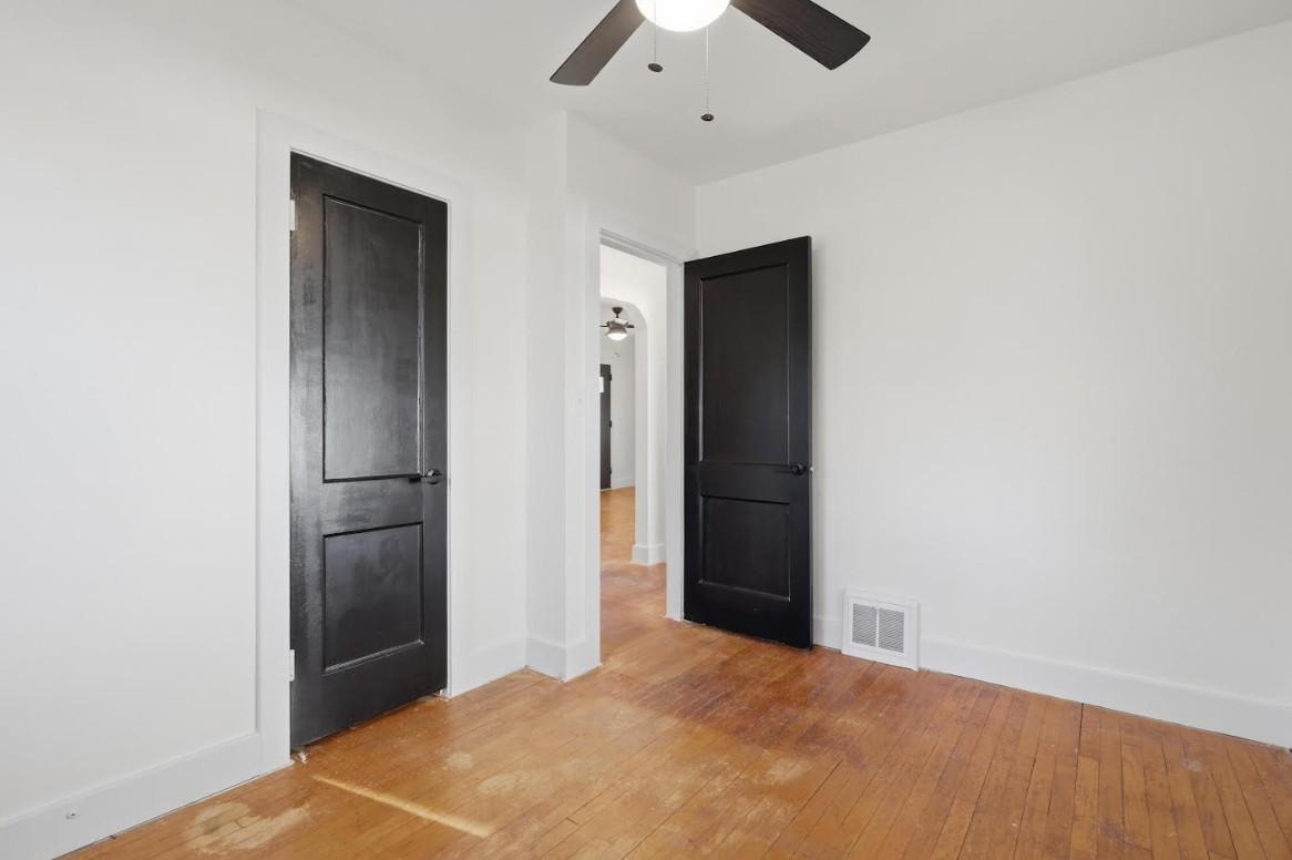 2633 16th Street Moline, IL 61265 - Photo 13 of 26 an empty room with closet and a chandelier fan
