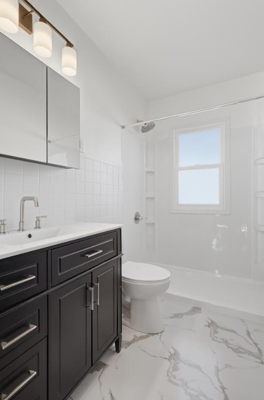 2633 16th Street Moline, IL 61265 - Photo 15 of 26 a bathroom with a sink a toilet and vanity