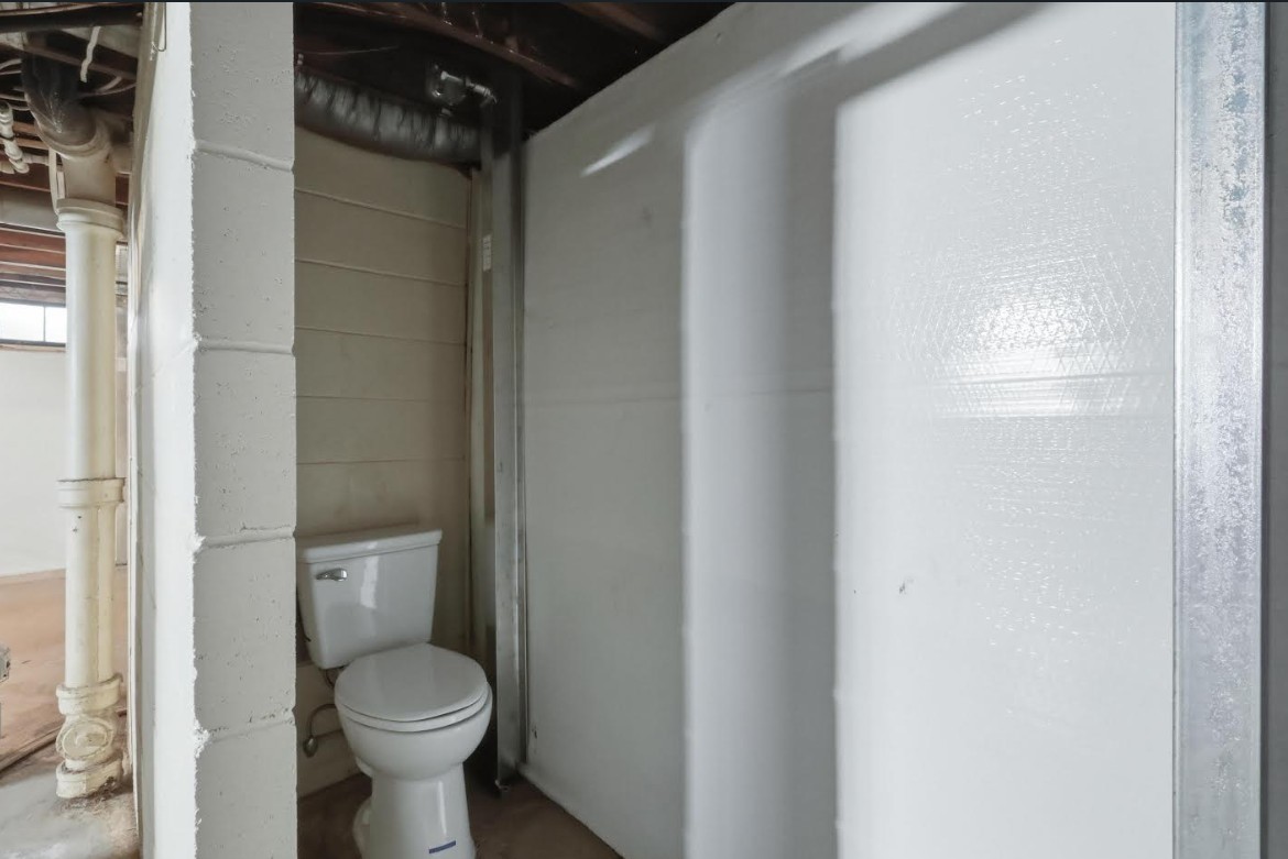 2633 16th Street Moline, IL 61265 - Photo 20 of 26 a bathroom with a toilet and a shower