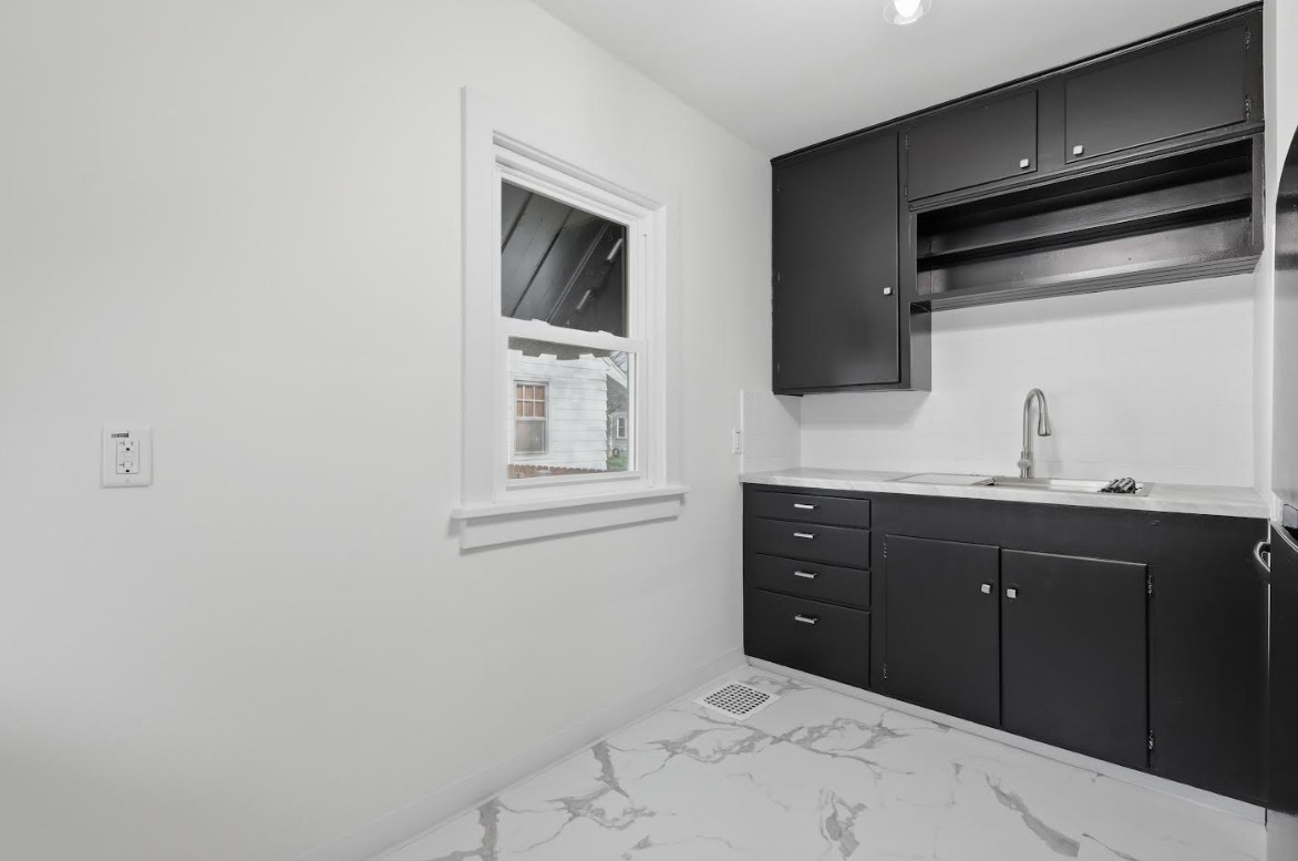 2633 16th Street Moline, IL 61265 - Photo 8 of 26 a bathroom with a sink vanity and mirror