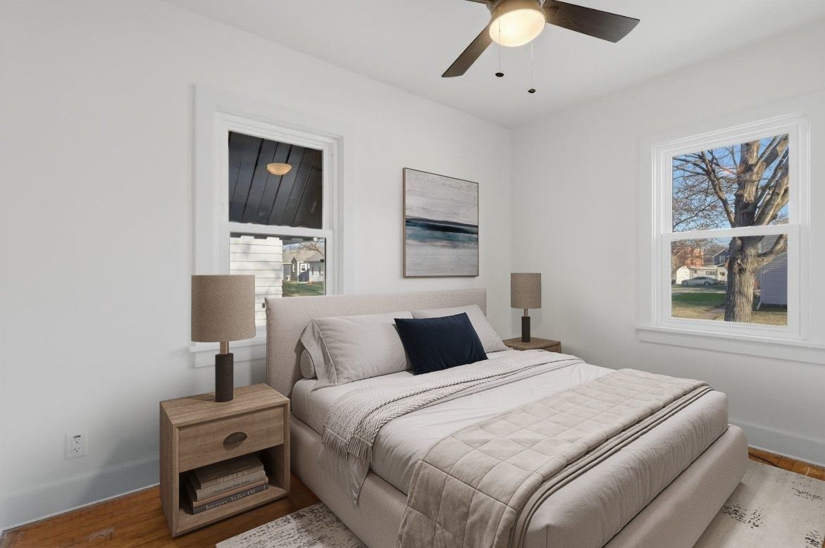 2633 16th Street Moline, IL 61265 - Photo 10 of 26 a bedroom with a bed and a painting on the wall